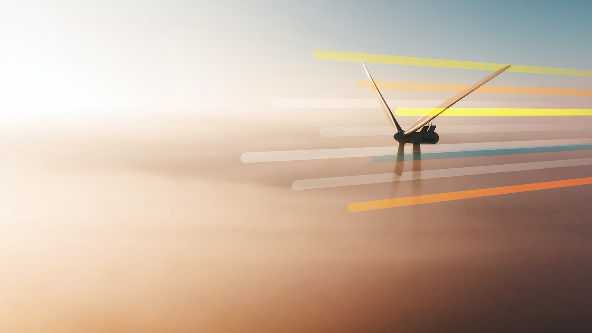 The top of a wind turbine is illuminated by morning light while the rest of the surroundings are obscured by fog.